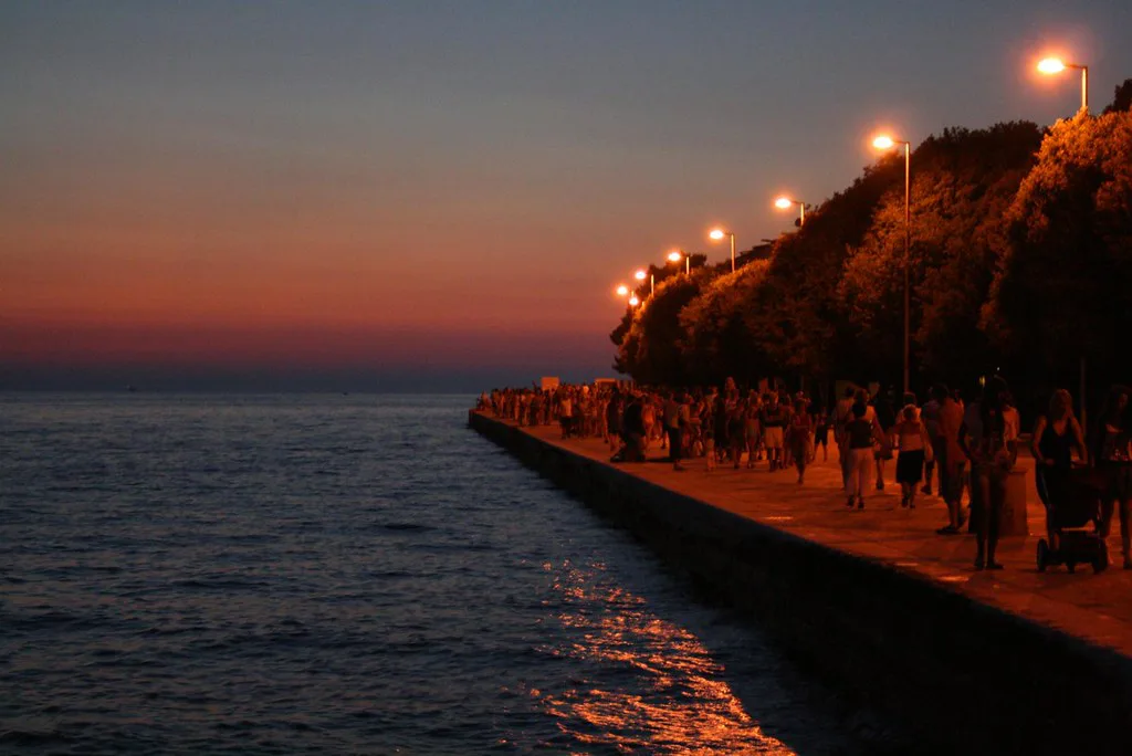 Visitors gathered along the Sea Organ promenade in Zadar at sunset