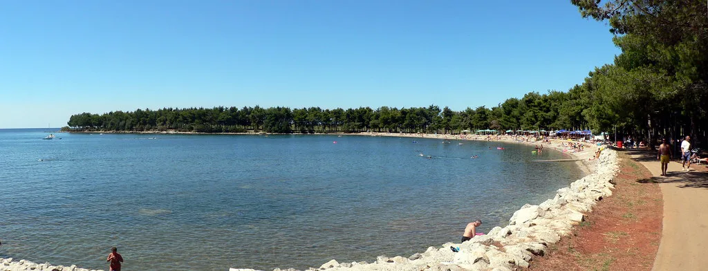 A rocky beach and shoreline path on the coast north of Poreč