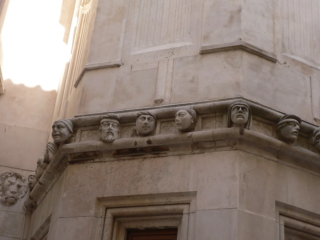 Carved stone heads on the outside of St James Cathedral in Šibenik