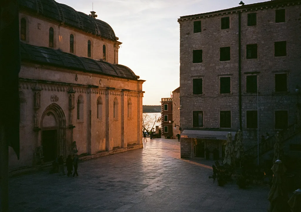 The side of St James Cathedral on a paved square in Šibenik's old town.