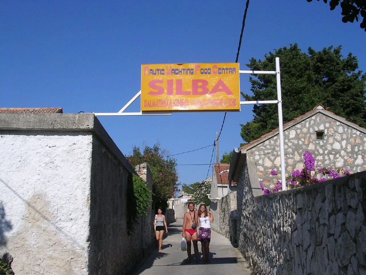 A narrow stone lane with a Silba sign in the village on Silba island.
