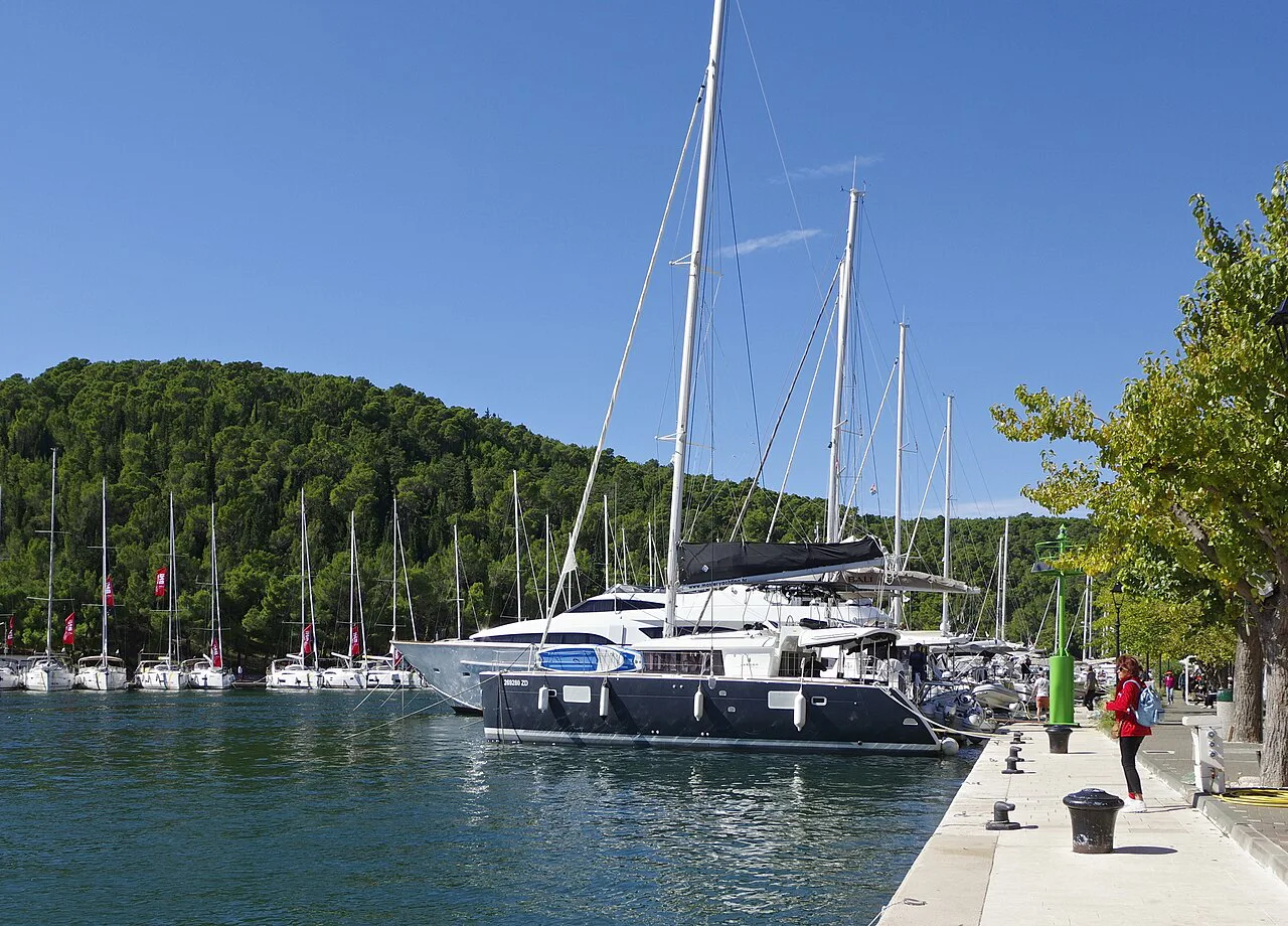 Sailing yachts moored along the harbour quay in Skradin, Krka National Park