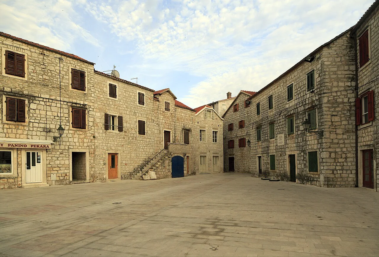 A triangular stone-paved square on the waterfront in Stari Grad, Hvar