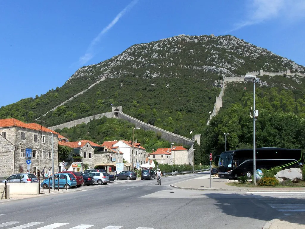 The defensive walls of Ston climbing the hillside above the town, Southern Dalmatia