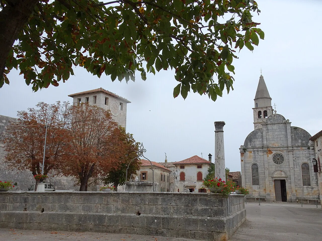 The main square of Svetvinčenat with a church and stone column, Istria