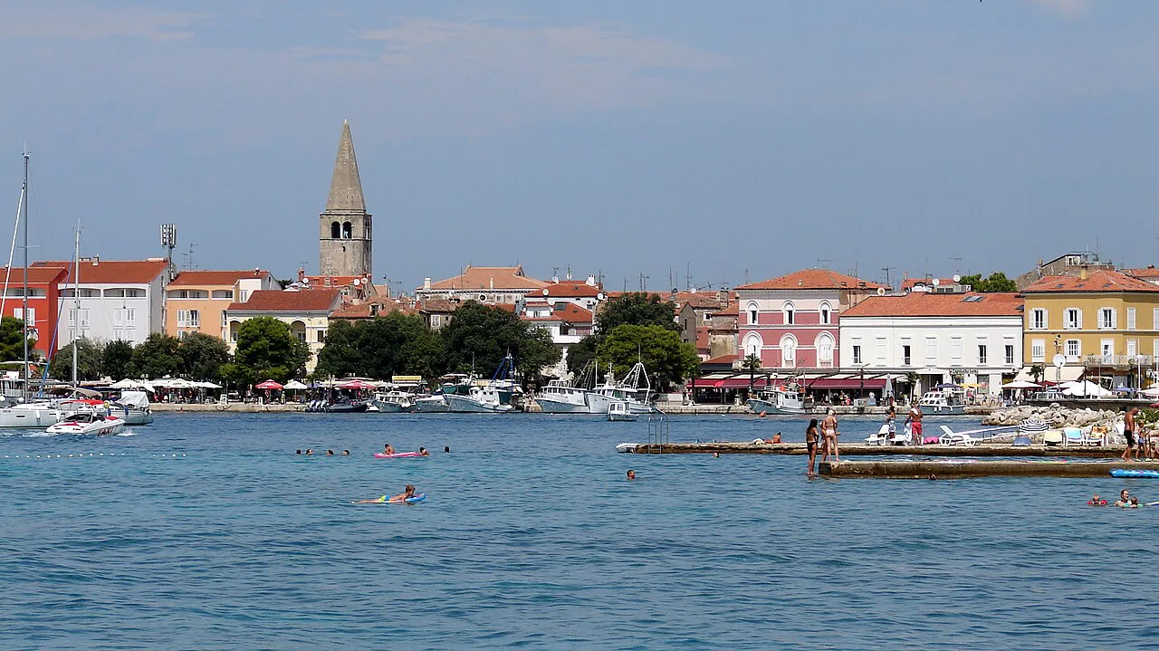 Poreč old town with its bell tower seen across the harbour.