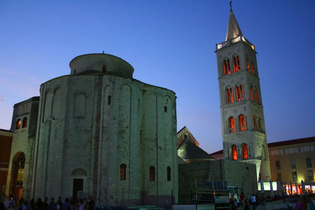 St Donatus' Church and the cathedral bell tower in Zadar at dusk.