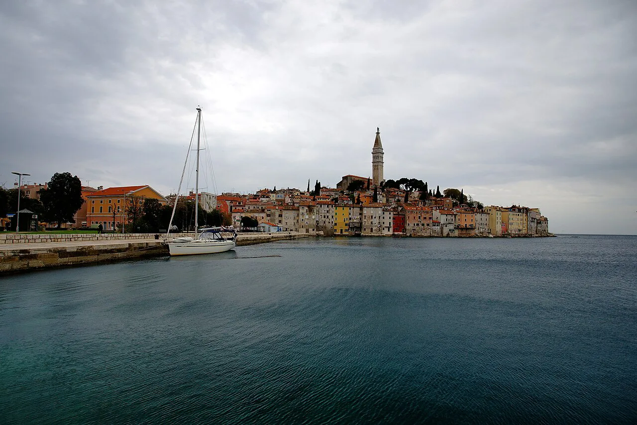 The port of Valdibora with Rovinj old town and its bell tower beyond