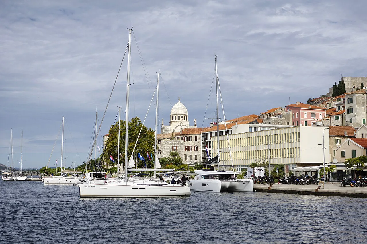 Sailing boats moored along the harbour waterfront in Šibenik