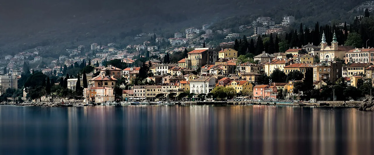 A panorama of Volosko and its shoreline reflected in the water, Kvarner