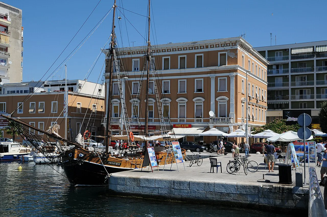 A sailing ship moored beside buildings on Obala Kneza Branimira in Zadar