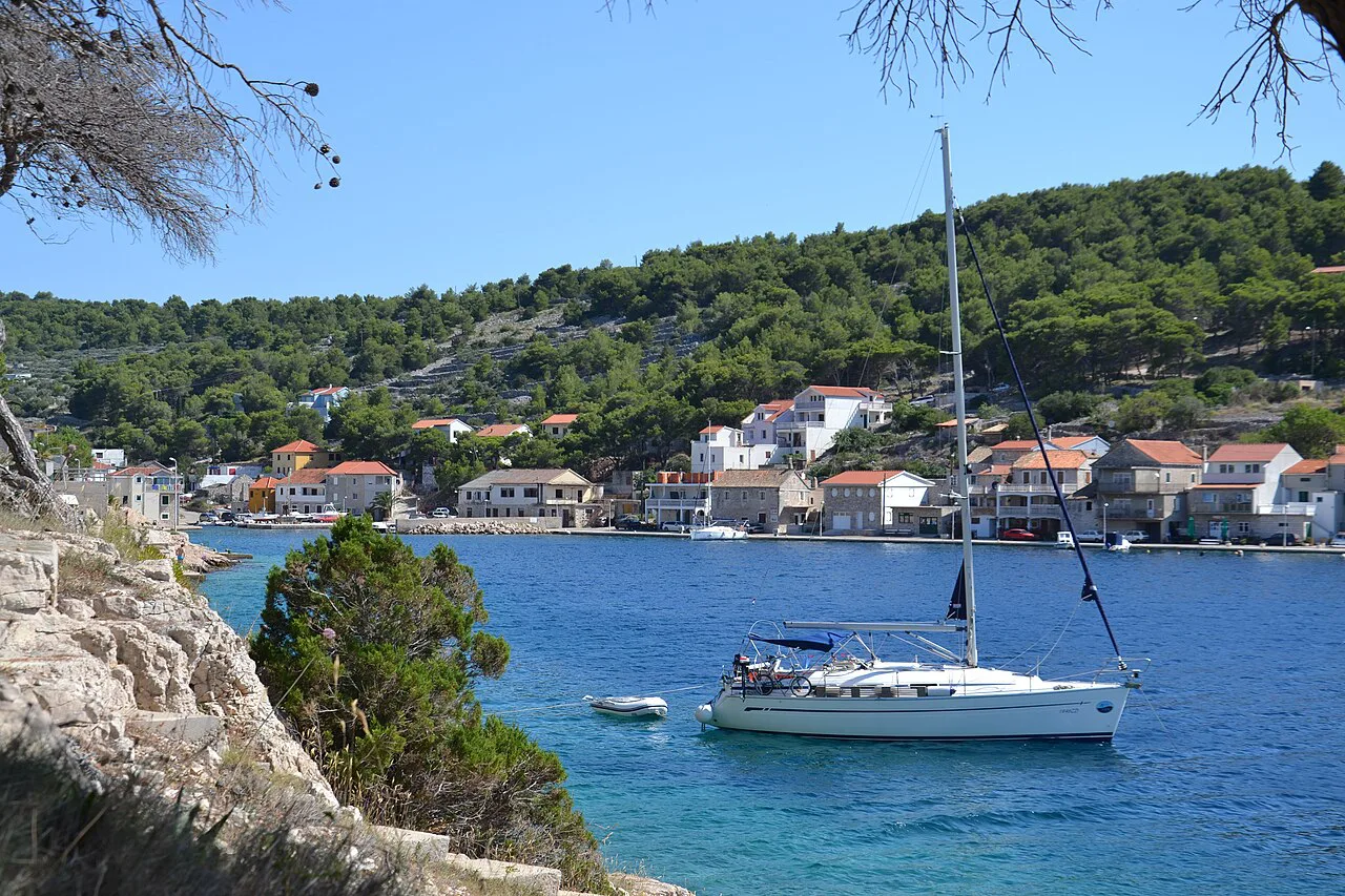 A sailing boat moored off the village on the island of Žirje, Šibenik